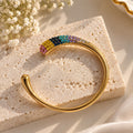 Gold-tone open cuff bracelet with multicolor crystal stones